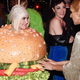 Illustration for article titled Celebrate the height of fashion by watching Katy Perry become a hamburger in front of J.Lo